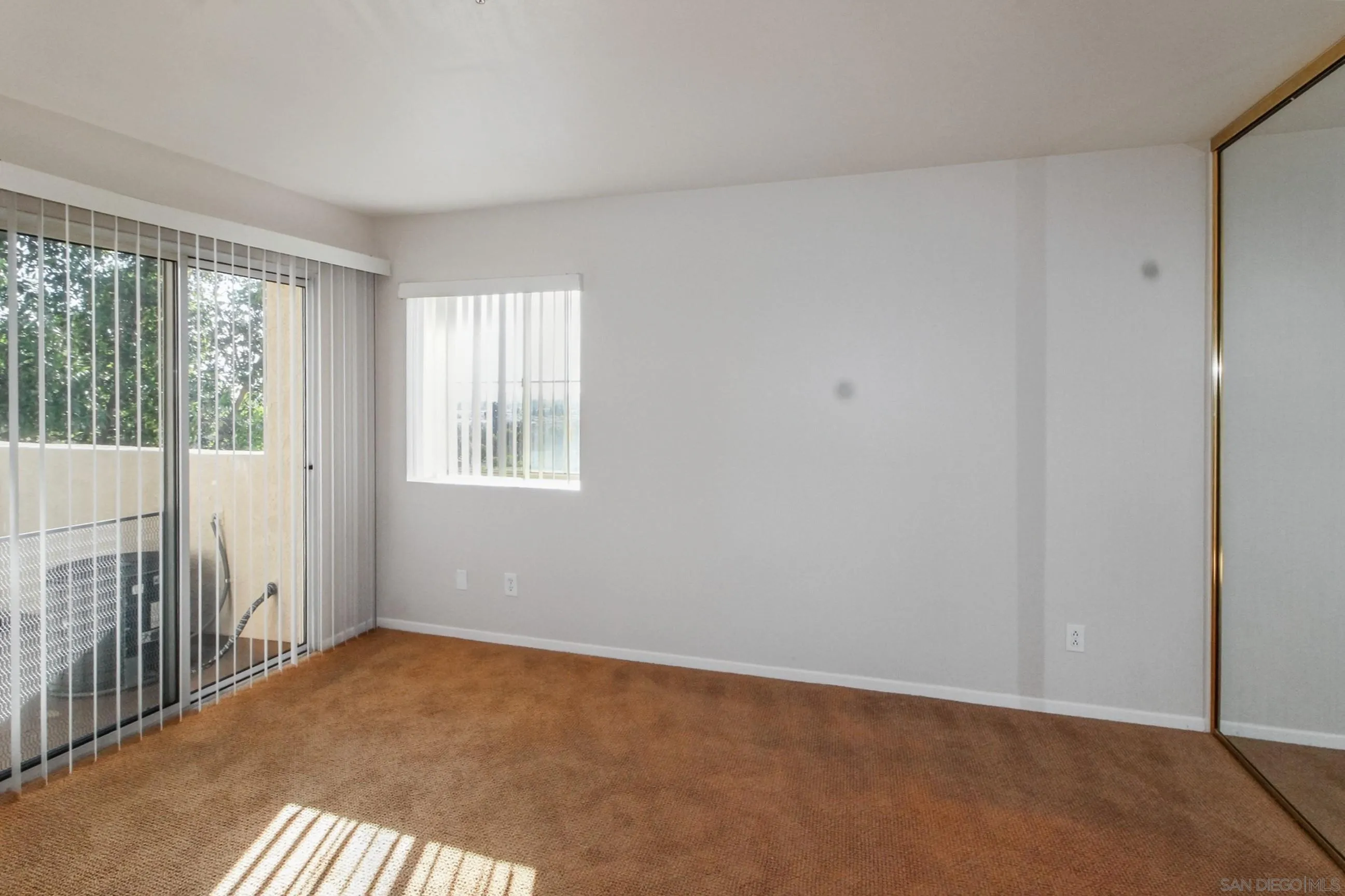 11175 Affinity Court, Unit 45 San Diego, CA 92131 - Photo 19 of 36 a view of an empty room with a window