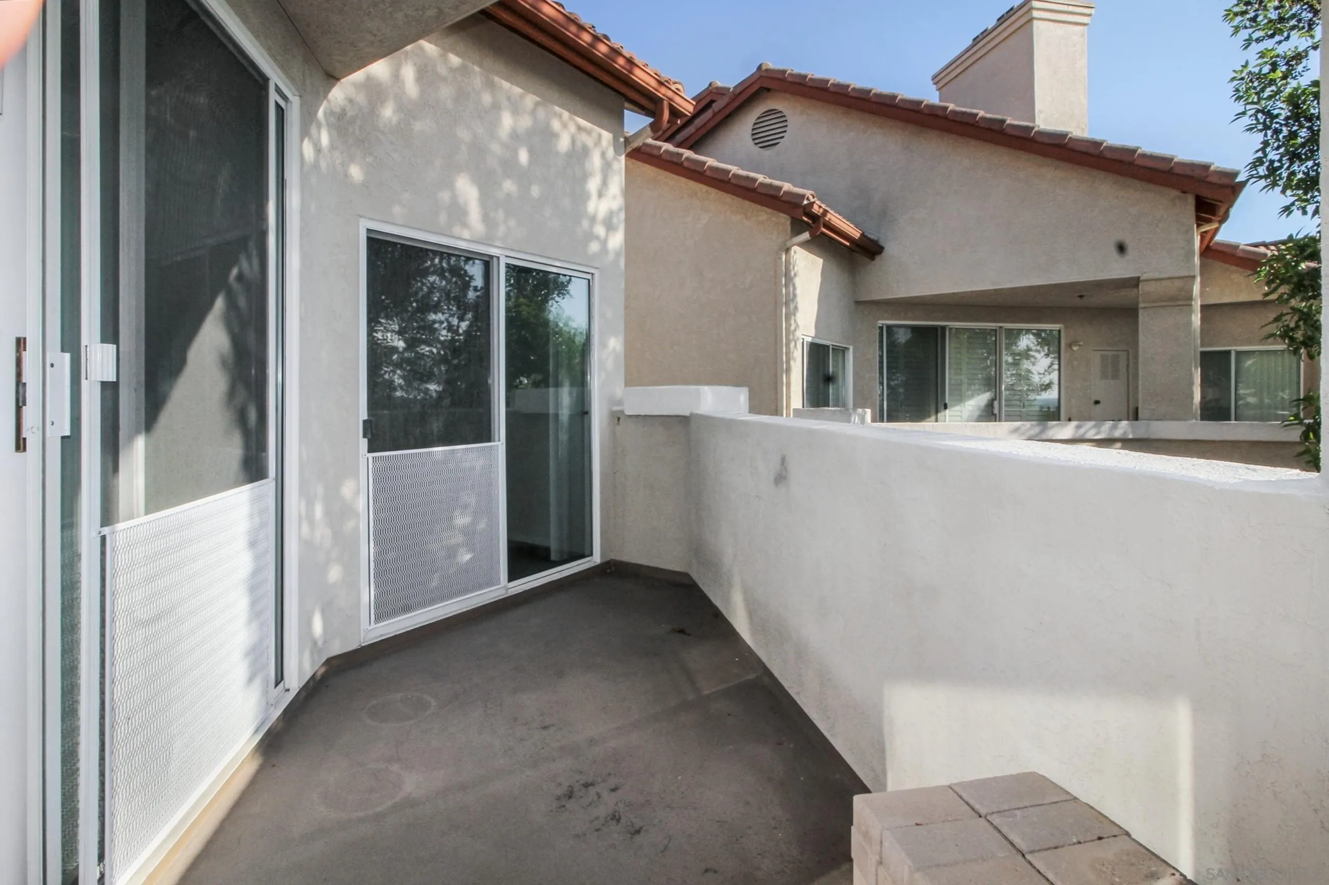 11175 Affinity Court, Unit 45 San Diego, CA 92131 - Photo 29 of 36 a view of a house with porch