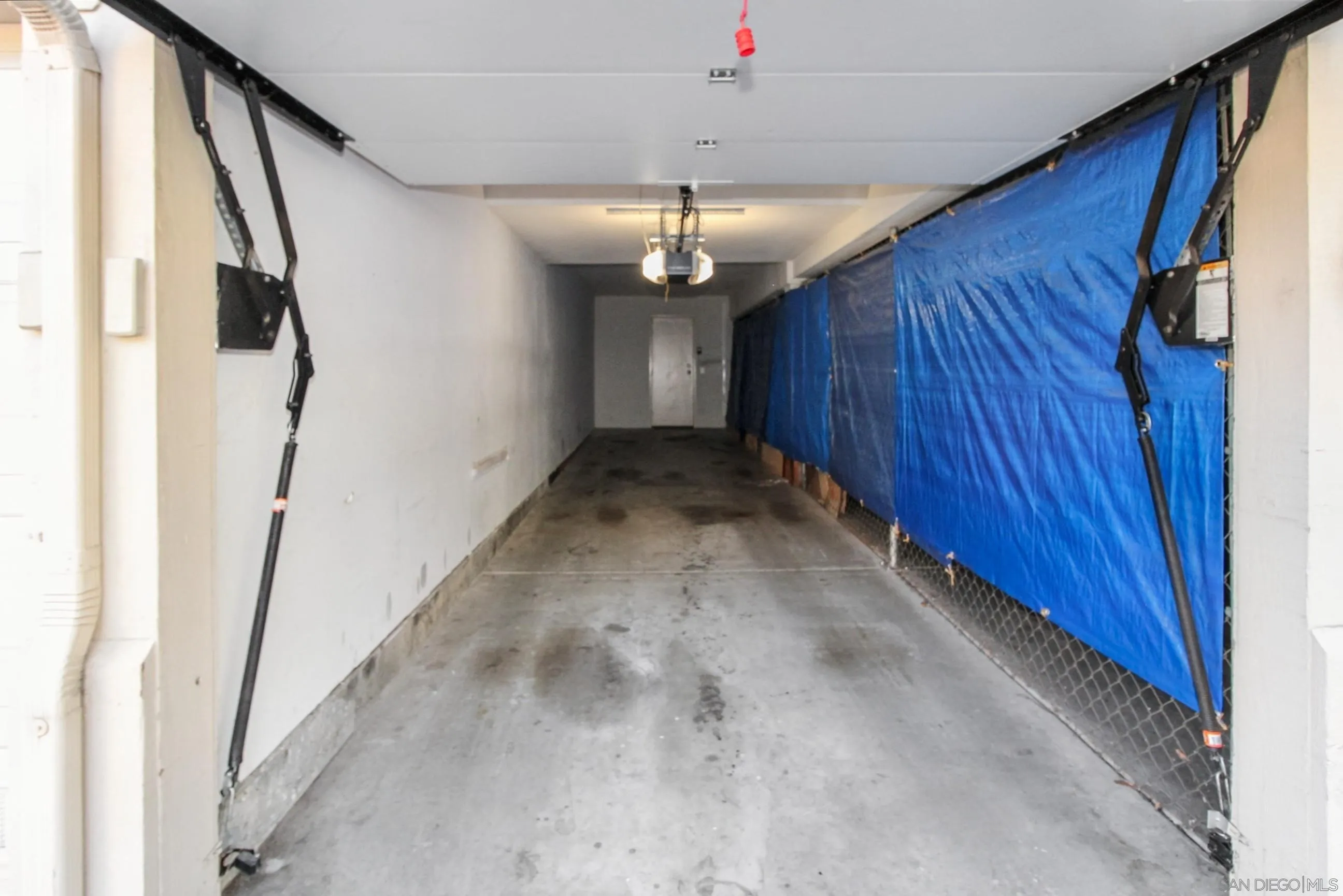 11175 Affinity Court, Unit 45 San Diego, CA 92131 - Photo 33 of 36 a view of a hallway with a chandelier