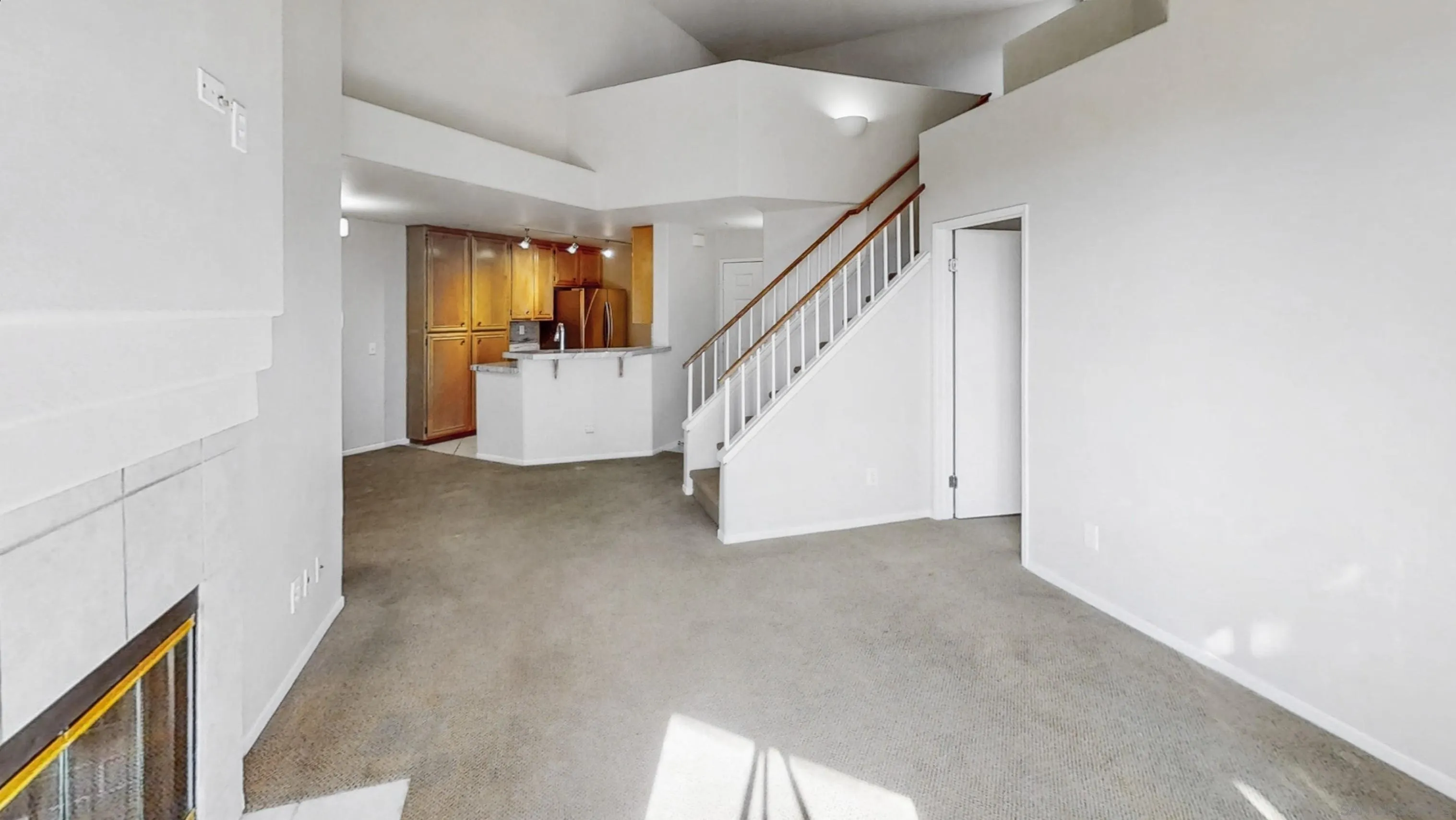 11175 Affinity Court, Unit 45 San Diego, CA 92131 - Photo 7 of 36 a view of a hallway with staircase