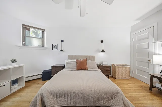 a bathroom with a sink mirror and shower