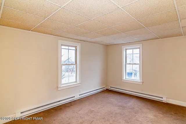 an empty room with windows