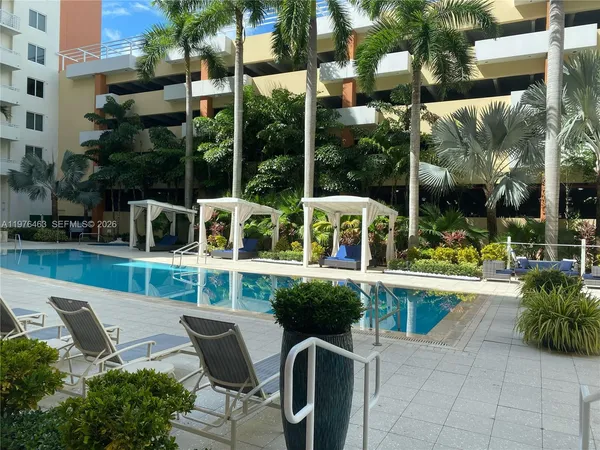 a view of a chair and tables in the patio