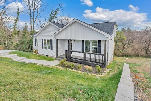 a house that has a big yard in front of it