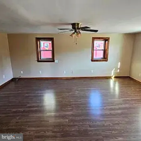 a view of a livingroom with wooden floor