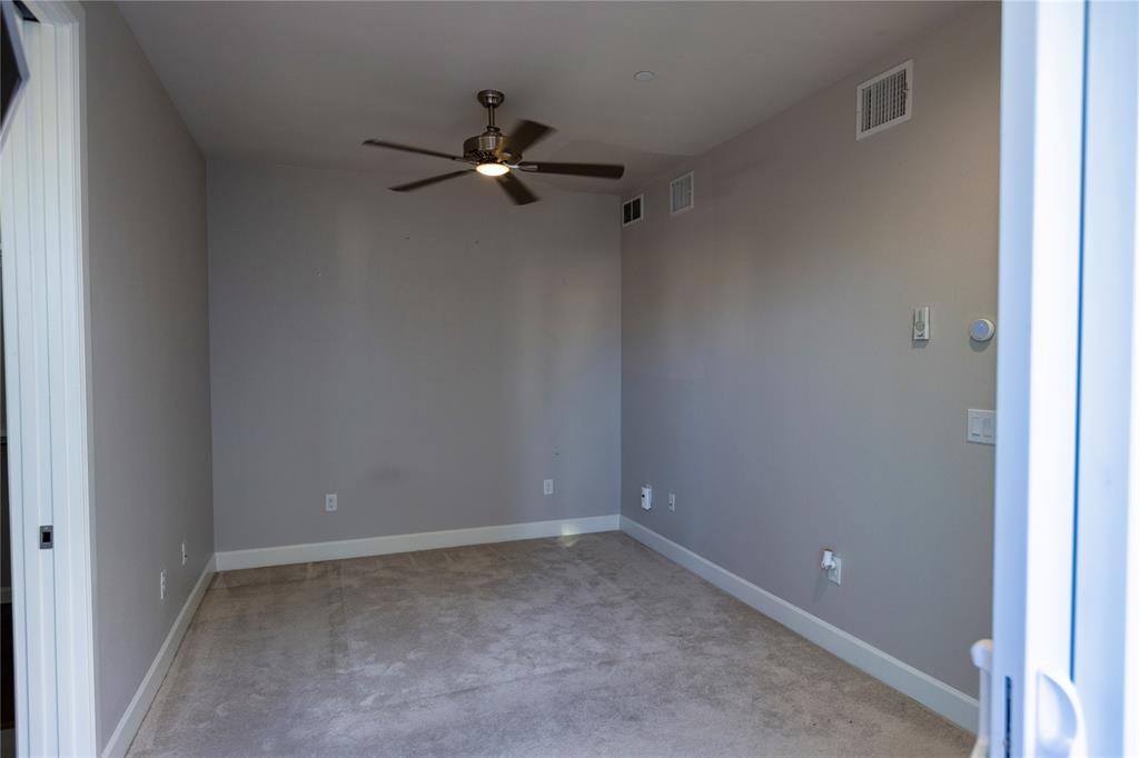 2016 North Fitzhugh Avenue, Unit 101 Dallas, TX 75204 - Photo 14 of 26 Primary Bedroom with ceiling fan and carpet floors