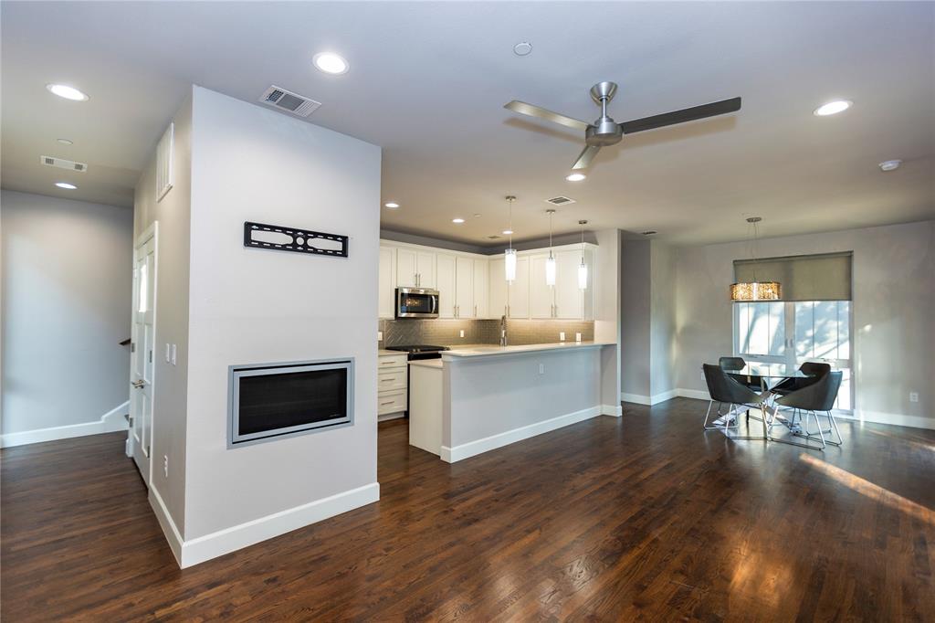 2016 North Fitzhugh Avenue, Unit 101 Dallas, TX 75204 - Photo 7 of 26 Kitchen with light countertops, white cabinetry, pendant lighting, dark wood finished floors, and recessed lighting