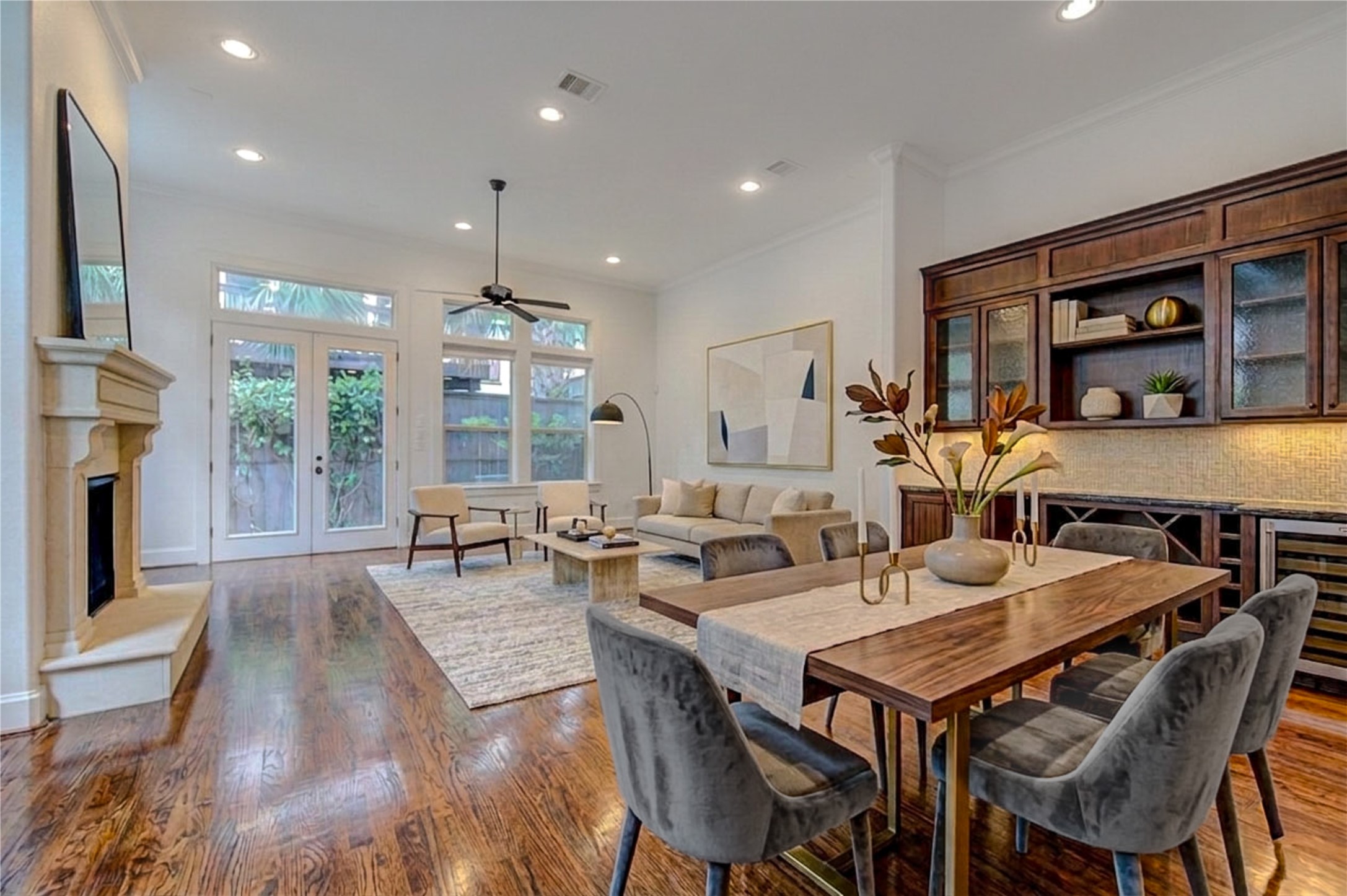 6520 Rodrigo Street Houston, TX 77007 - Photo 10 of 44 Integrated living and kitchen spaces highlighted by high ceilings, hardwood floors, and expansive natural light. Digitally Staged.