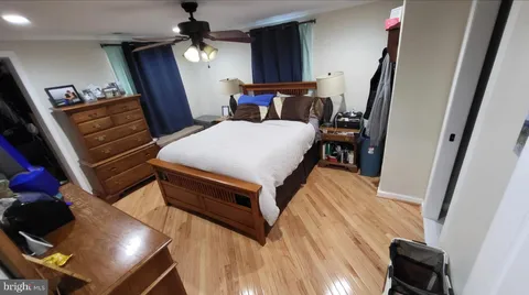 a bed room with a bed and a chandelier