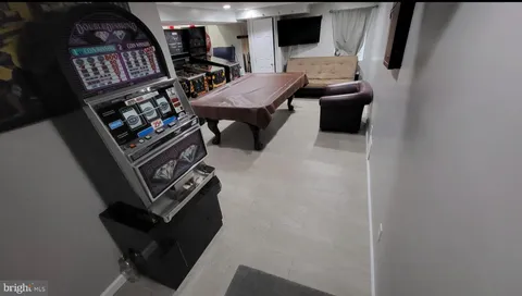 a view of a livingroom with furniture and a flat screen tv