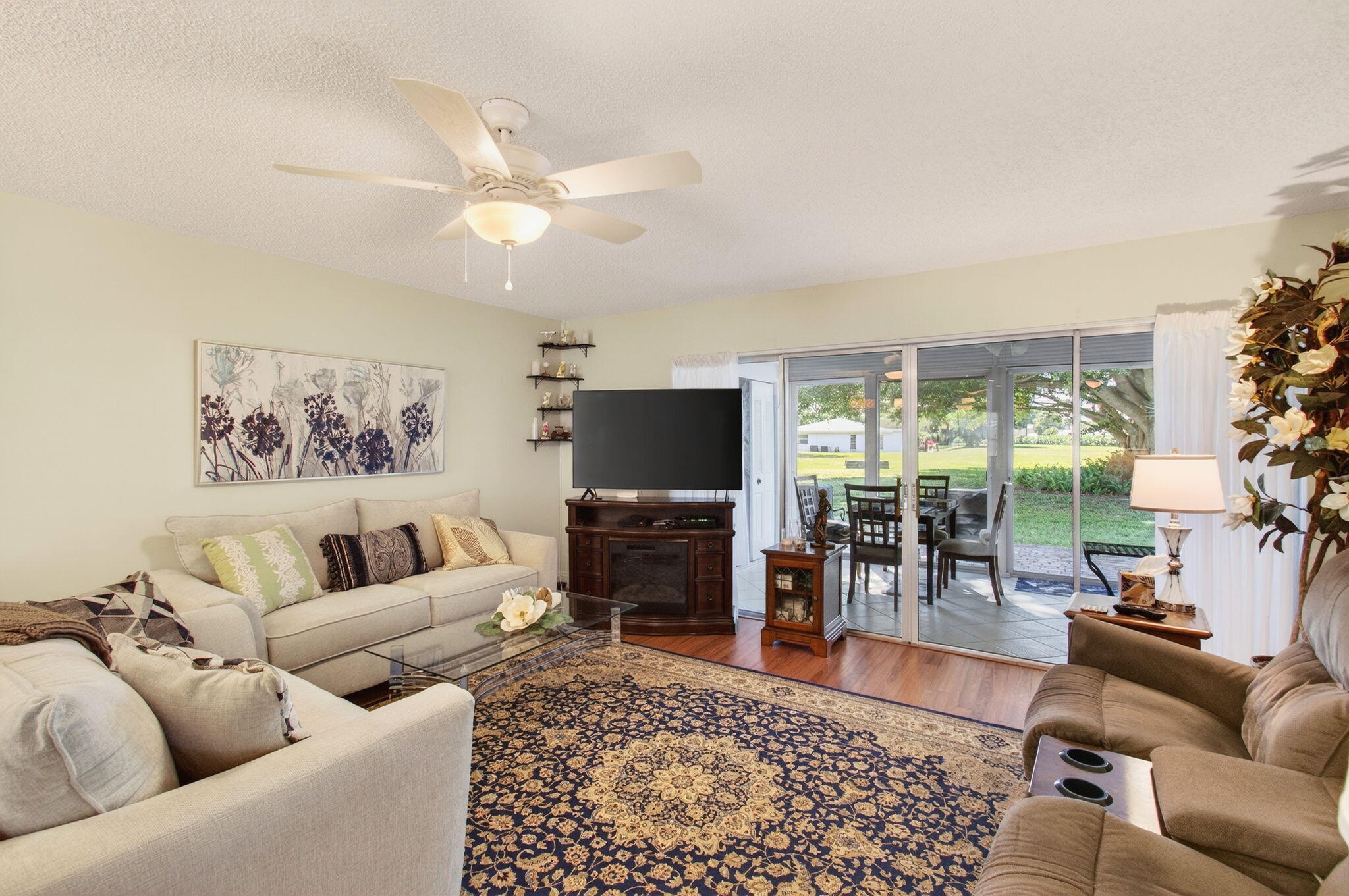 5452 Poppy Place, Unit D Delray Beach, FL 33484 - Photo 20 of 62 a living room with furniture and a flat screen tv