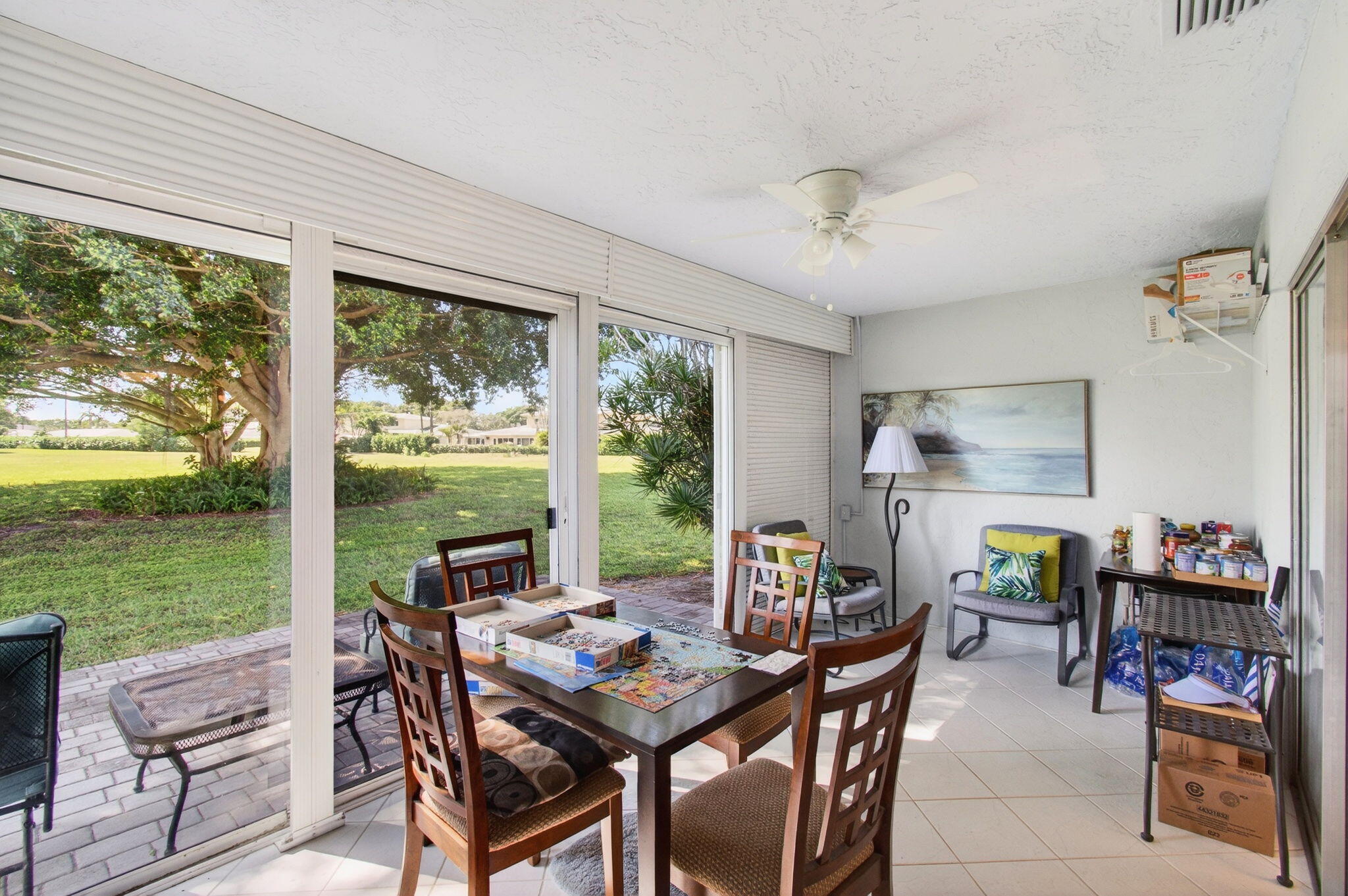 5452 Poppy Place, Unit D Delray Beach, FL 33484 - Photo 22 of 62 a view of a dining room with furniture window and outside view