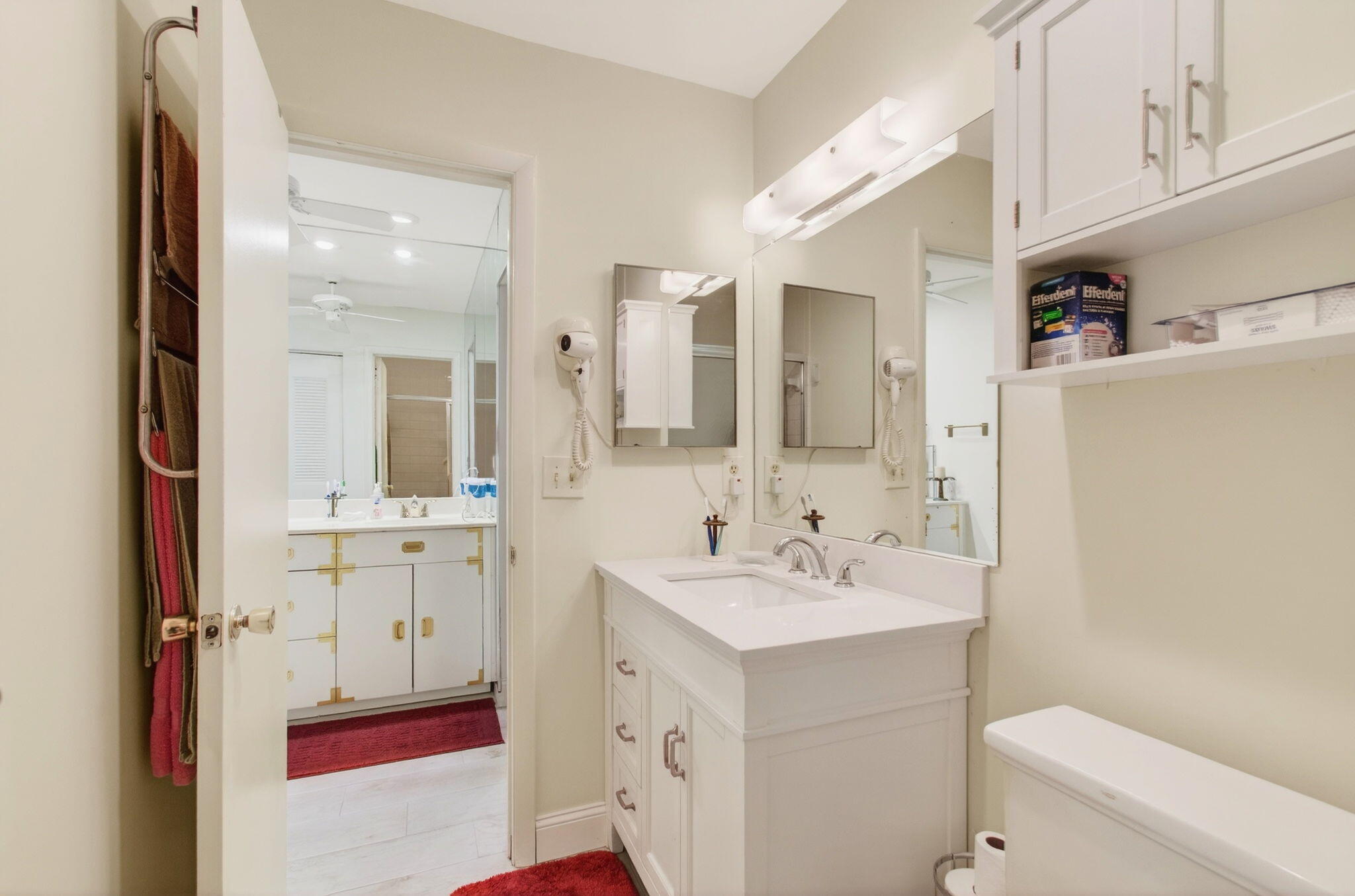 5452 Poppy Place, Unit D Delray Beach, FL 33484 - Photo 35 of 62 a spacious bathroom with a double vanity sink mirror and toilet