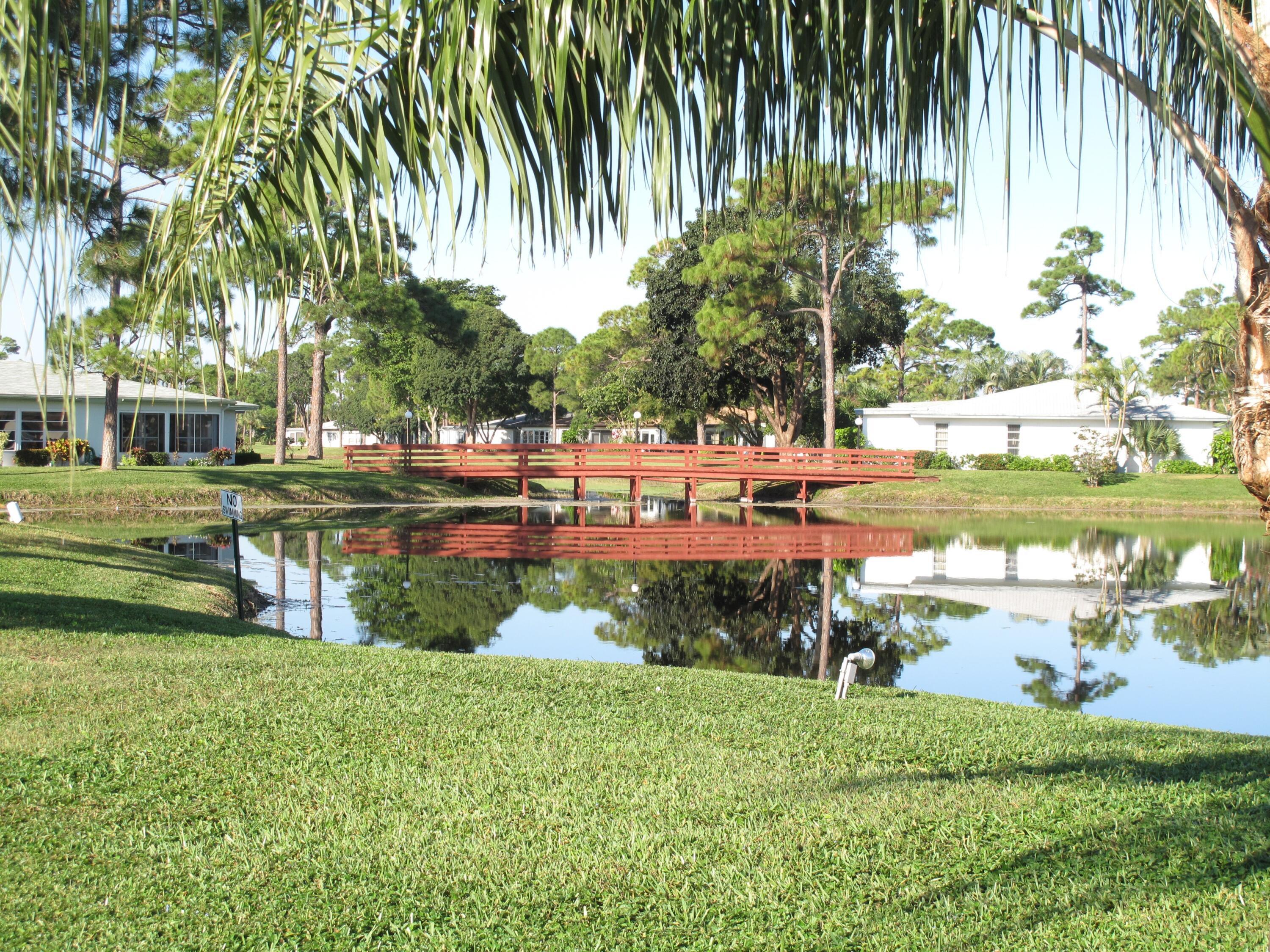 5452 Poppy Place, Unit D Delray Beach, FL 33484 - Photo 53 of 62 view of a park with large trees