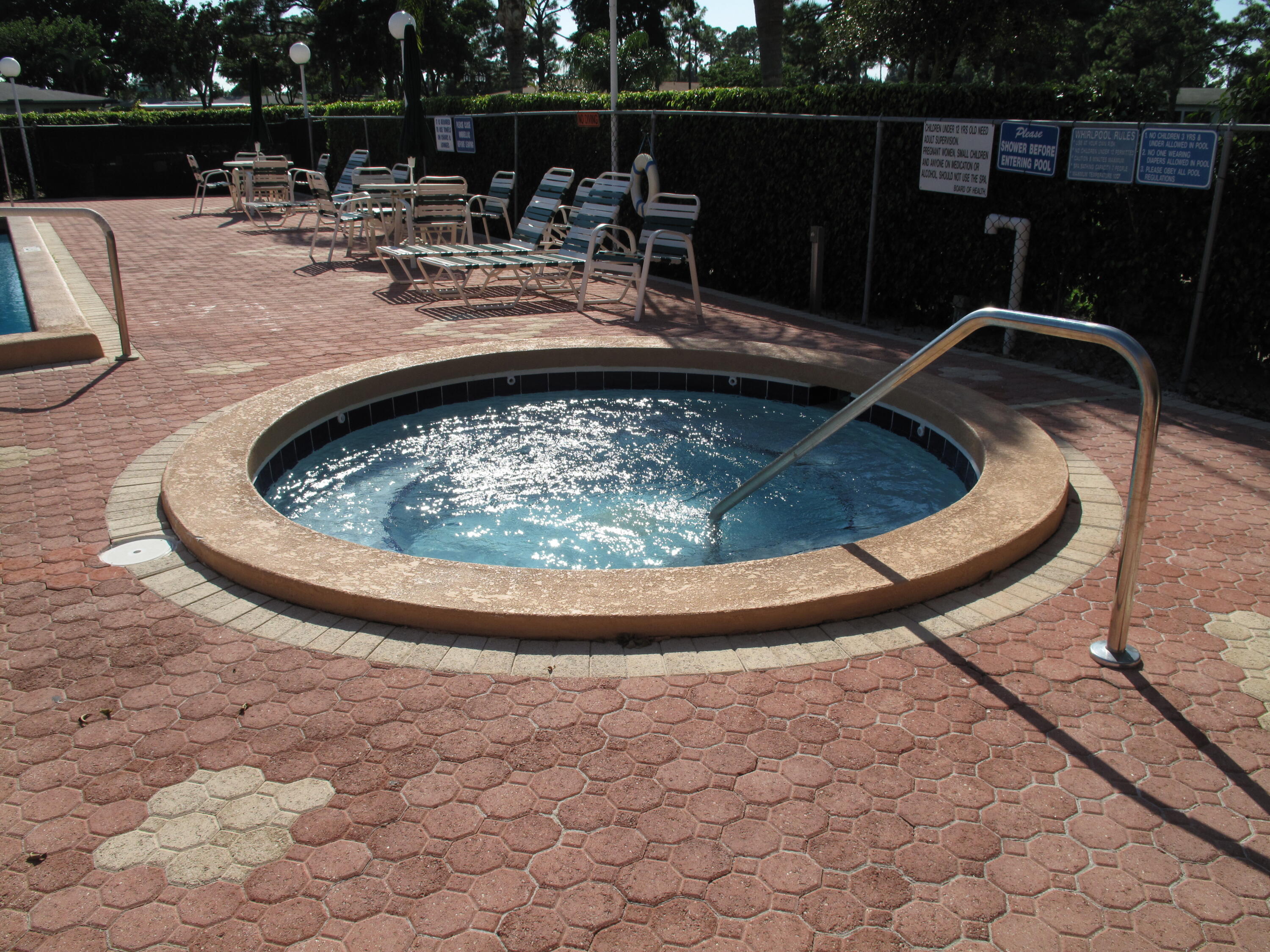 5452 Poppy Place, Unit D Delray Beach, FL 33484 - Photo 56 of 62 a view of swimming pool with seating space