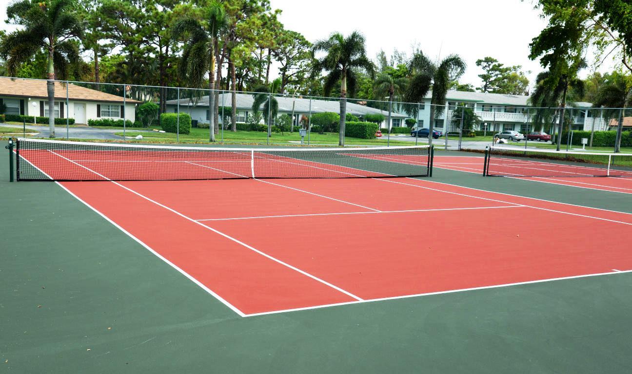 5452 Poppy Place, Unit D Delray Beach, FL 33484 - Photo 57 of 62 a tennis court that has tennis net