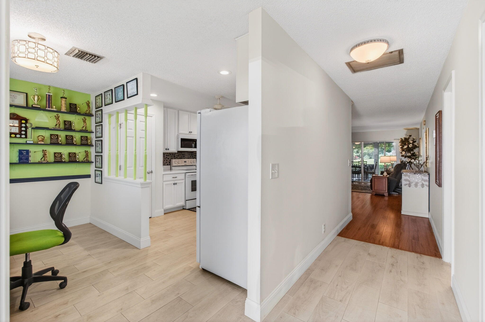 5452 Poppy Place, Unit D Delray Beach, FL 33484 - Photo 6 of 62 a view of kitchen with furniture and a refrigerator
