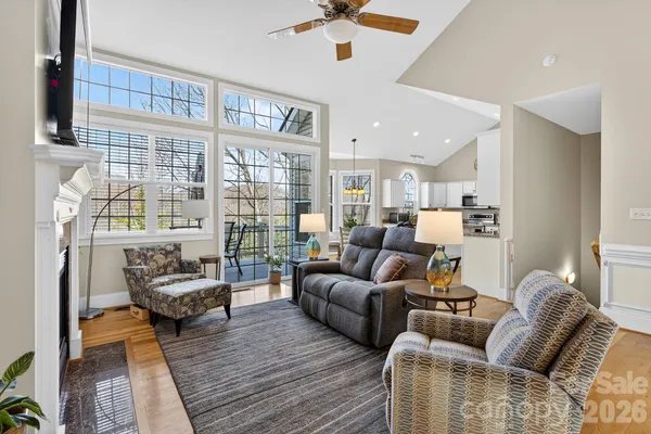 a kitchen with stainless steel appliances kitchen island granite countertop a refrigerator and microwave