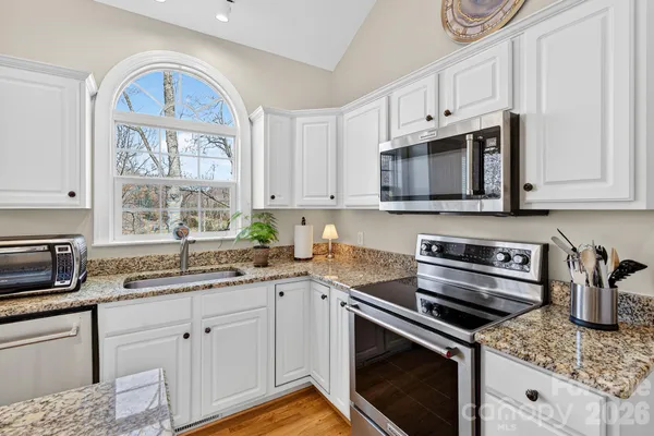 a balcony with furniture and a window
