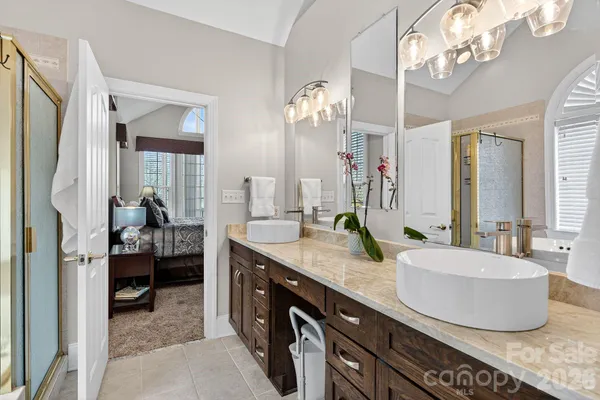 a bathroom with a tub and a sink