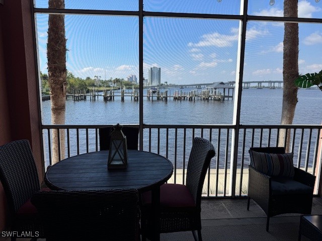 2743 First Street, Unit 105 Fort Myers, FL 33916 - Photo 13 of 29 a view of a balcony with a table and chairs