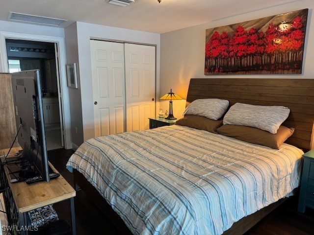 2743 First Street, Unit 105 Fort Myers, FL 33916 - Photo 16 of 29 a bedroom with a bed and a dresser