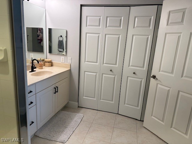 2743 First Street, Unit 105 Fort Myers, FL 33916 - Photo 19 of 29 a bathroom with a sink a mirror a vanity and a shower
