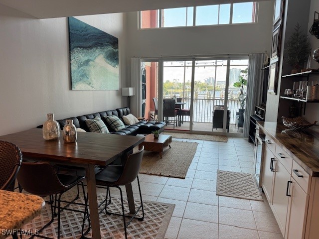 2743 First Street, Unit 105 Fort Myers, FL 33916 - Photo 5 of 29 a living room with furniture and a floor to ceiling window
