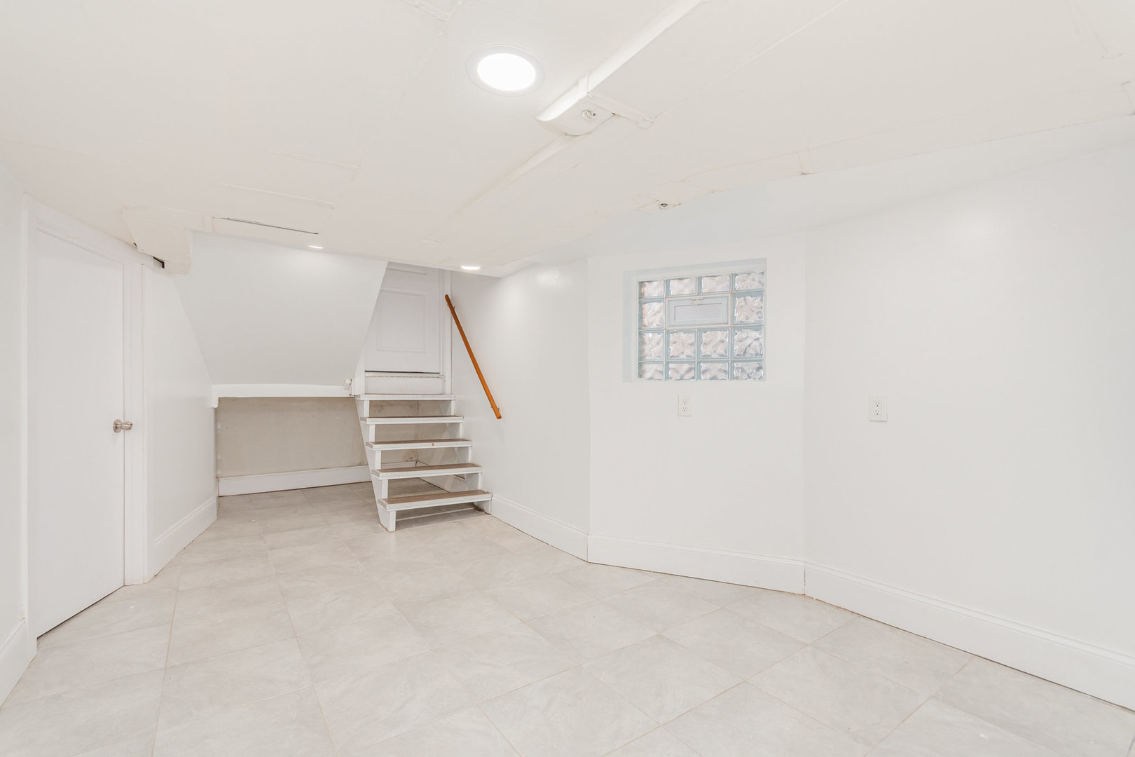 1250 North Monitor Avenue Chicago, IL 60651 - Photo 21 of 28 an empty room with a stairs and white walls