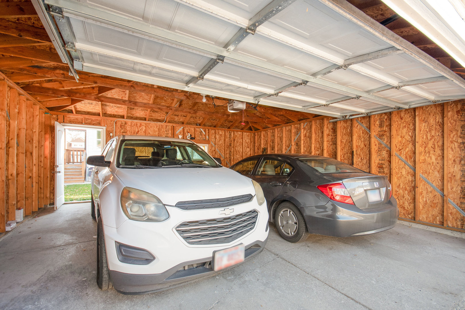 1250 North Monitor Avenue Chicago, IL 60651 - Photo 25 of 28 a car parked in a garage