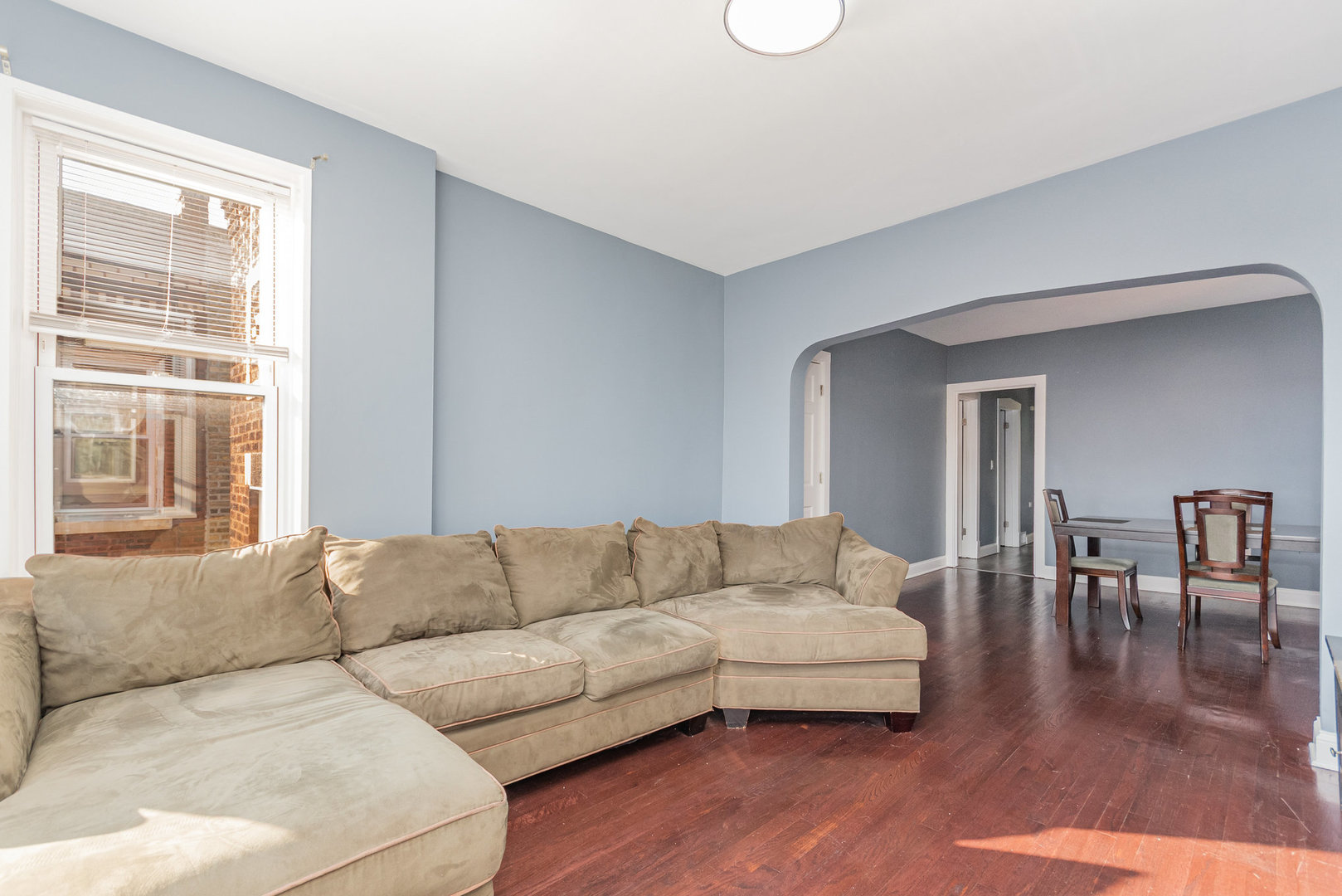 1250 North Monitor Avenue Chicago, IL 60651 - Photo 4 of 28 a living room with furniture and a large window