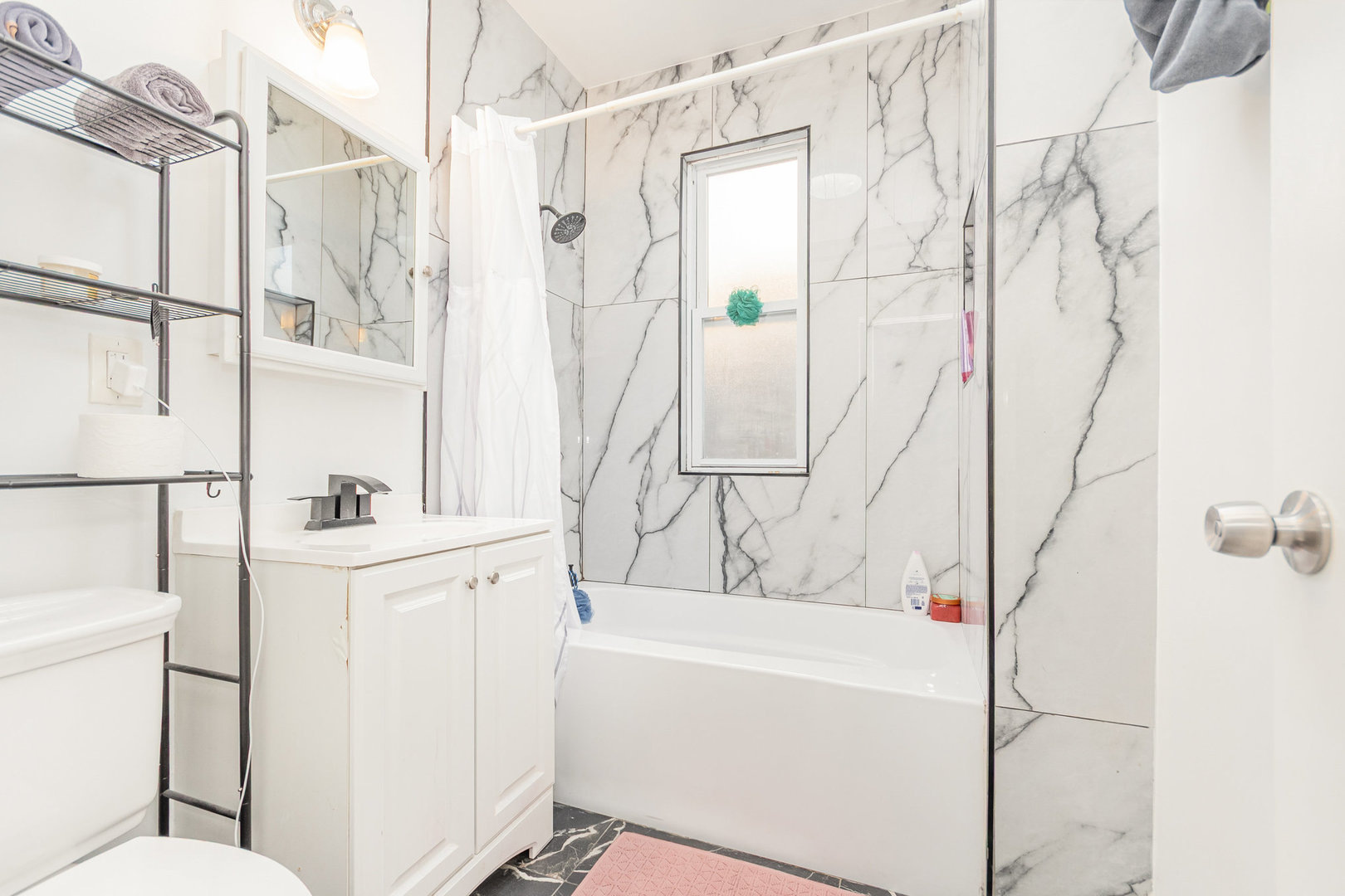 1250 North Monitor Avenue Chicago, IL 60651 - Photo 6 of 28 a bathroom with a bathtub and a shower