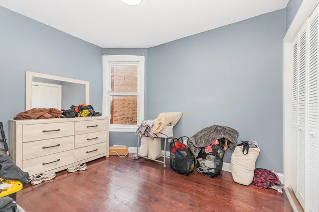 a bedroom with furniture and a window