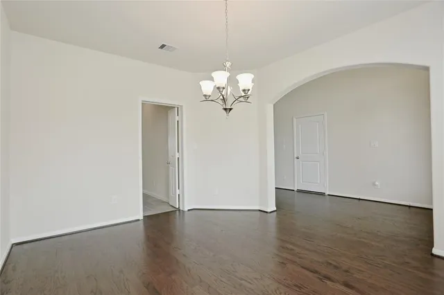 a view of a livingroom with wooden floor