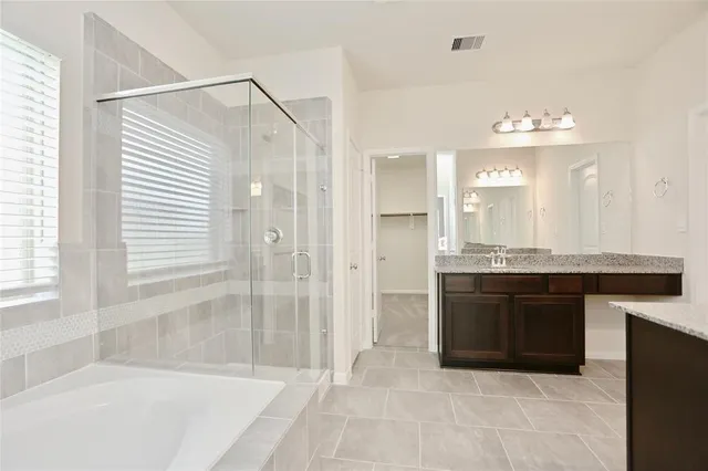 a bathroom with a bathtub and a sink