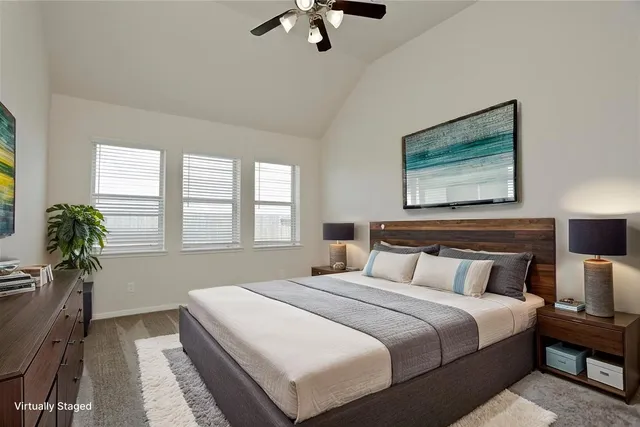 a bedroom with bed and window