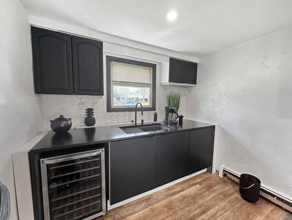a kitchen with a sink and cabinets