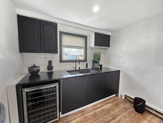 a kitchen with a sink and cabinets