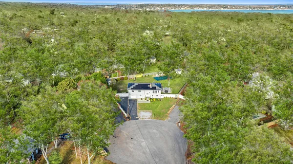 a view of a yard with table and chairs