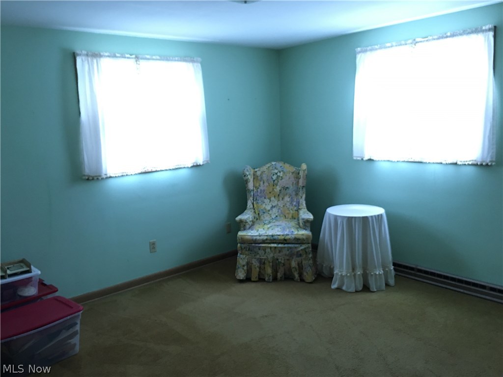 571 Garnette Road Akron, OH 44313 - Photo 10 of 21 Bedroom 2 with hardwood floors under area rug