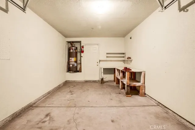 a view of kitchen and utility room with windows