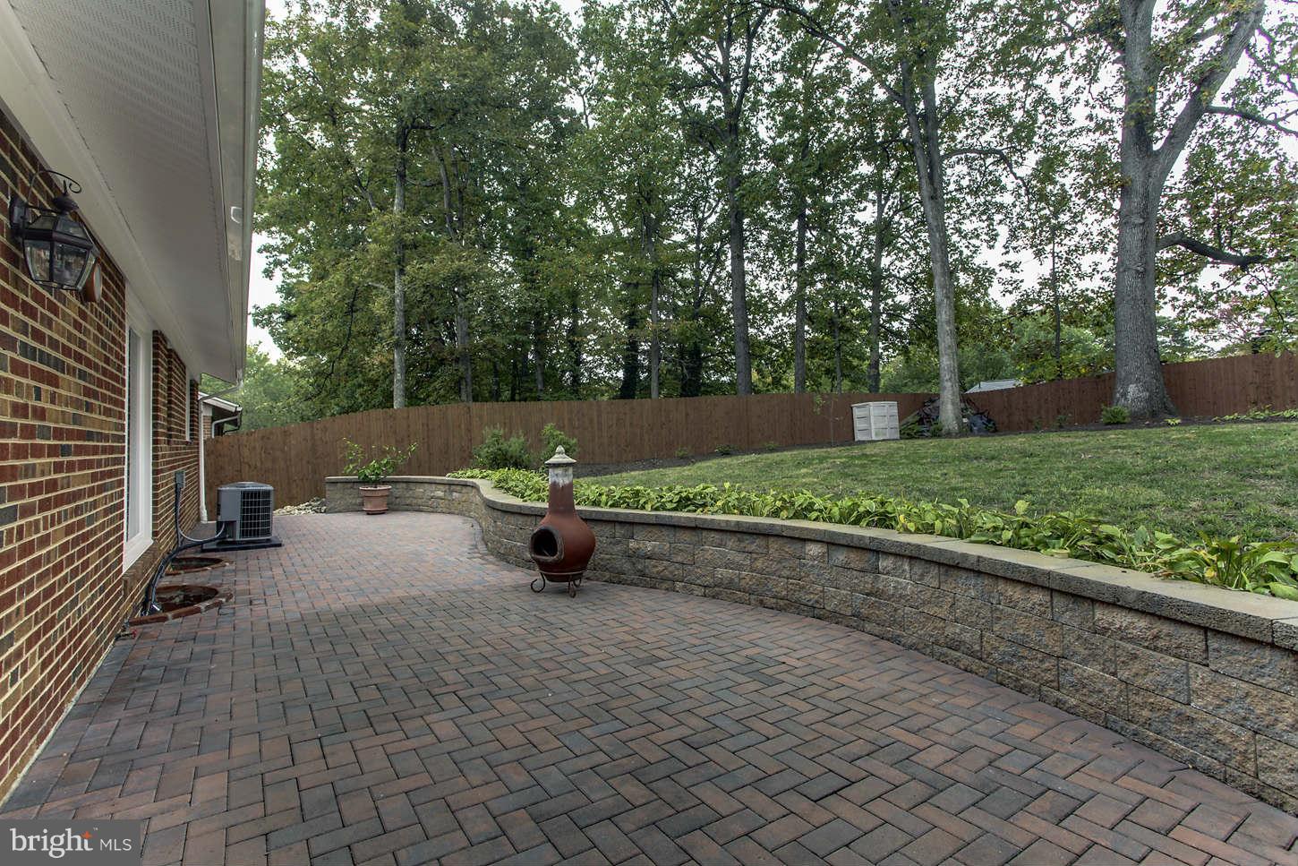 10710 Lombardy Road Silver Spring, MD 20901 - Photo 2 of 24 Courtyard Patio with Seat Wall