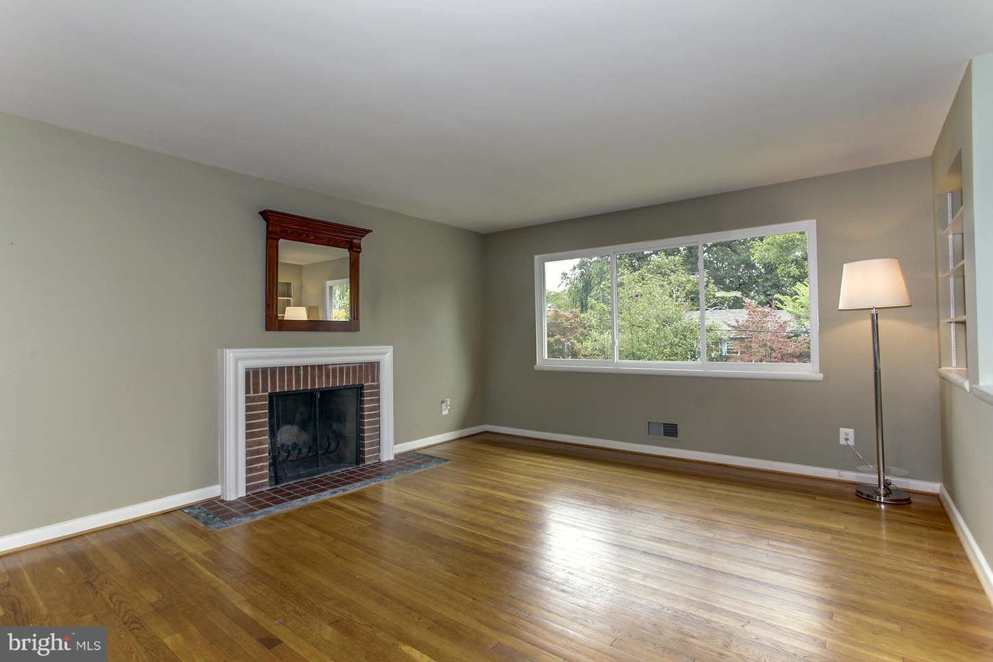 10710 Lombardy Road Silver Spring, MD 20901 - Photo 3 of 24 Living Room with Wood-Burning FP