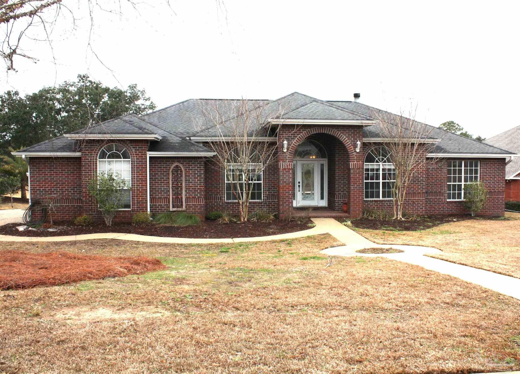 5708 Tamarack Drive Pace, FL 32571 - Photo 1 of 29 a front view of a house with a yard