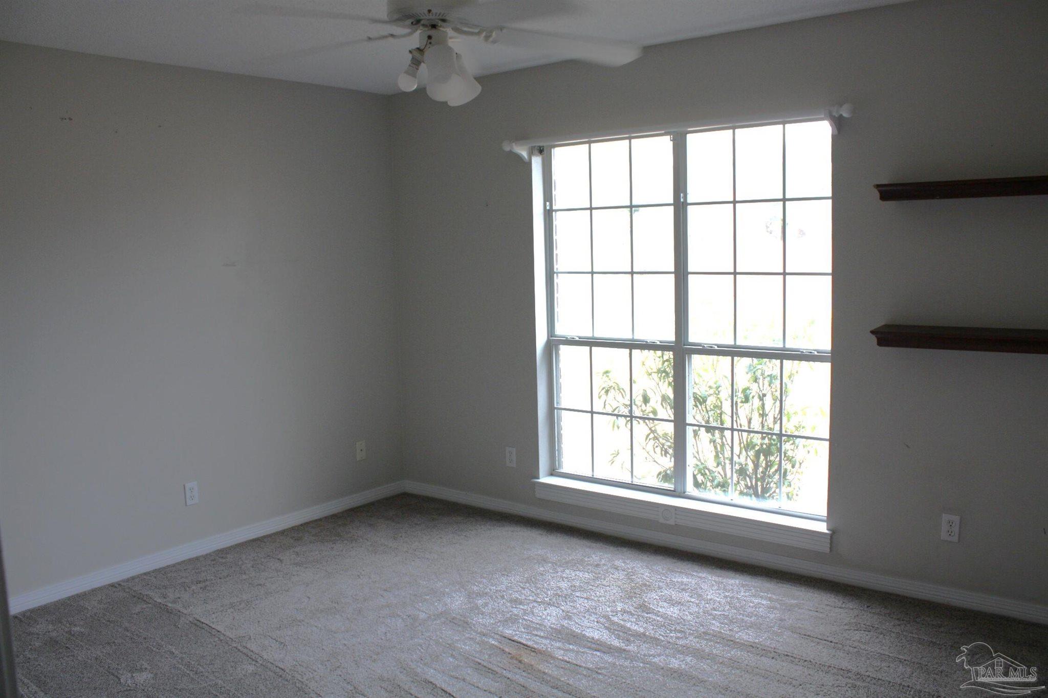 5708 Tamarack Drive Pace, FL 32571 - Photo 13 of 29 an empty room with a window