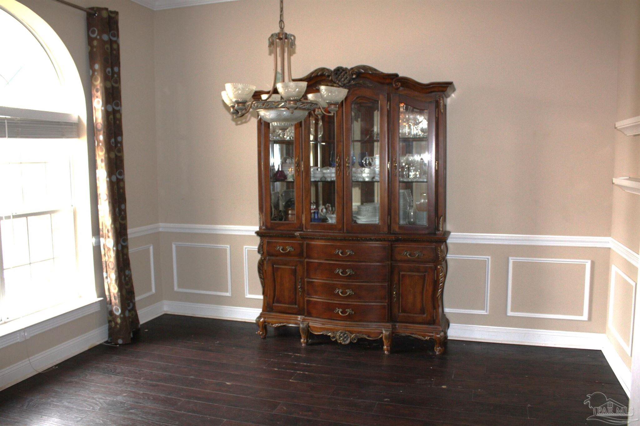 5708 Tamarack Drive Pace, FL 32571 - Photo 18 of 29 a view of a wooden floor and a window