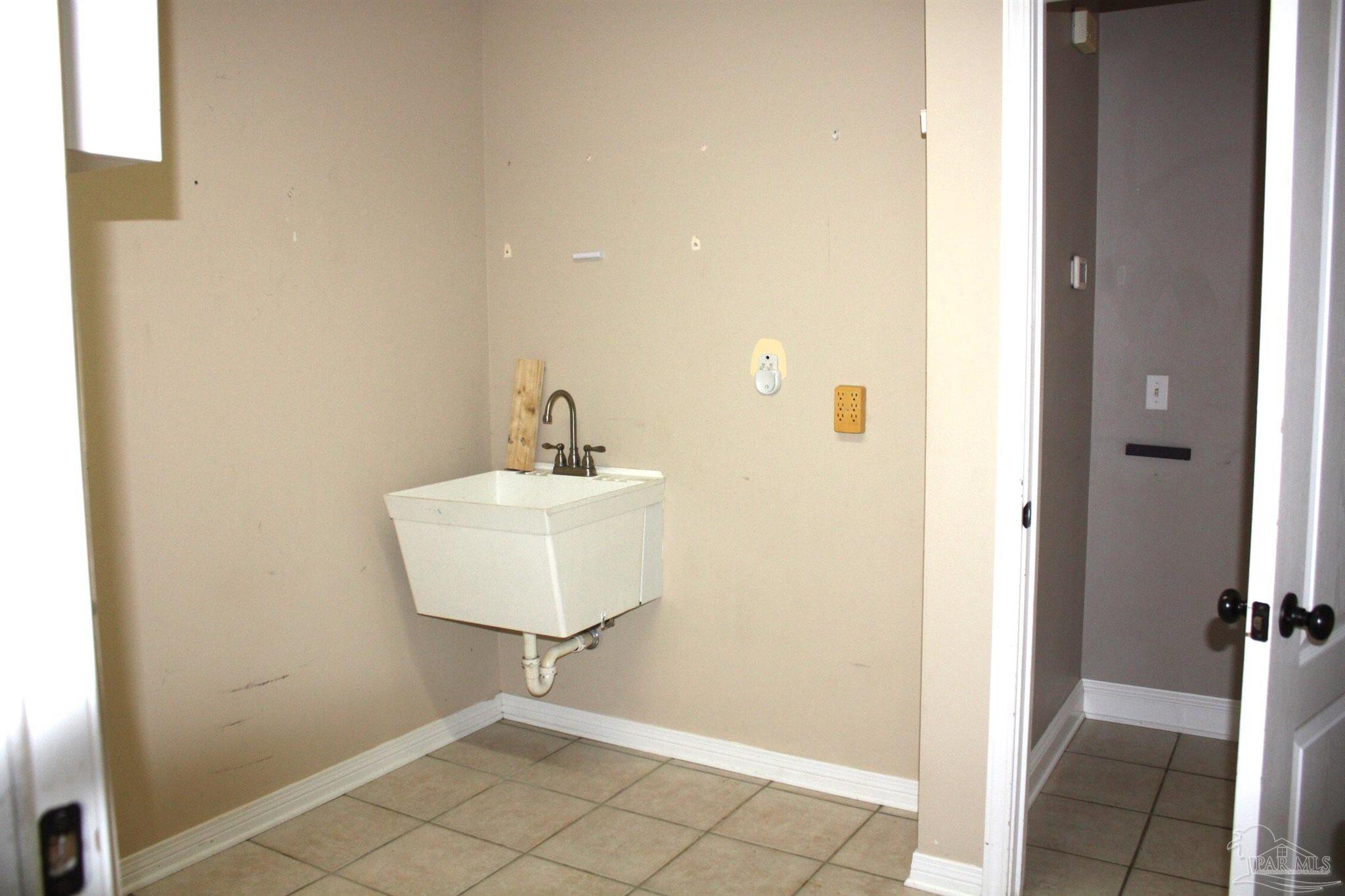 5708 Tamarack Drive Pace, FL 32571 - Photo 19 of 29 a bathroom with a sink and a mirror