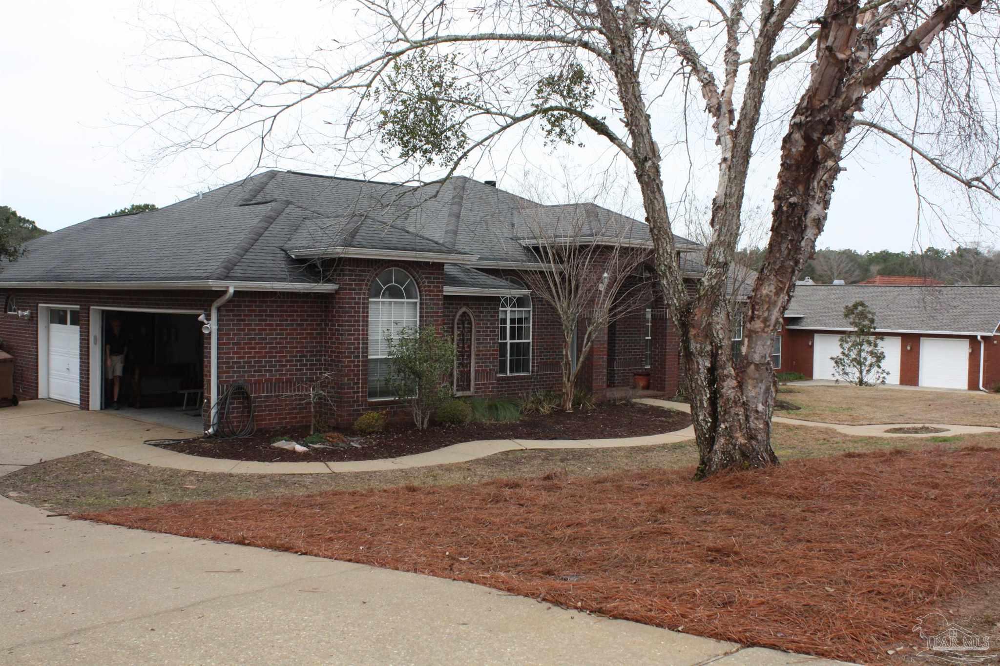 5708 Tamarack Drive Pace, FL 32571 - Photo 28 of 29 a front view of a house with a yard