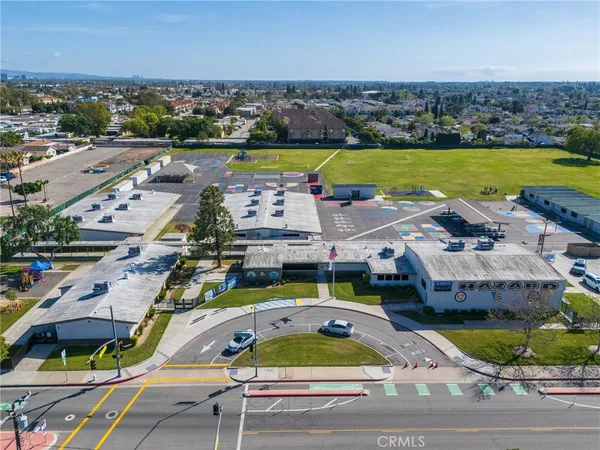 an aerial view of a house with a swimming pool yard and outdoor seating