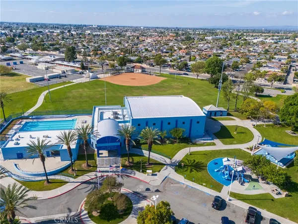 an aerial view of a house with a swimming pool yard and outdoor seating